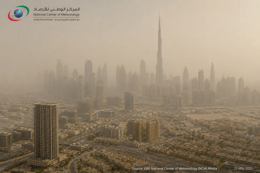 Aerial or wide-angle photograph of Dubai or Abu Dhabi skyline during a hazy or dust-laden day showing reduced visibility and particulate haze across the urban environment. Source: UAE National Center of Meteorology media or Creative Commons.
