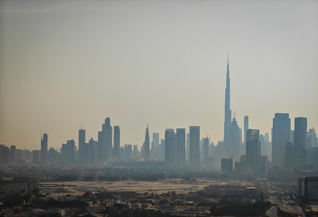 Dubai skyline during dusty weather showing why dust builds up in UAE homes - how-to-reduce-dust-dubai-homes