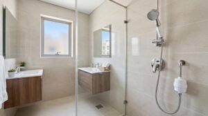 best-shower-filters-uae - Handheld filtered shower head and in-line shower filter in a modern UAE apartment bathroom