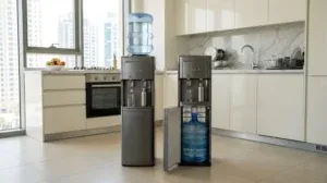 Bottom loading and top loading water dispensers side by side in a modern UAE apartment kitchen